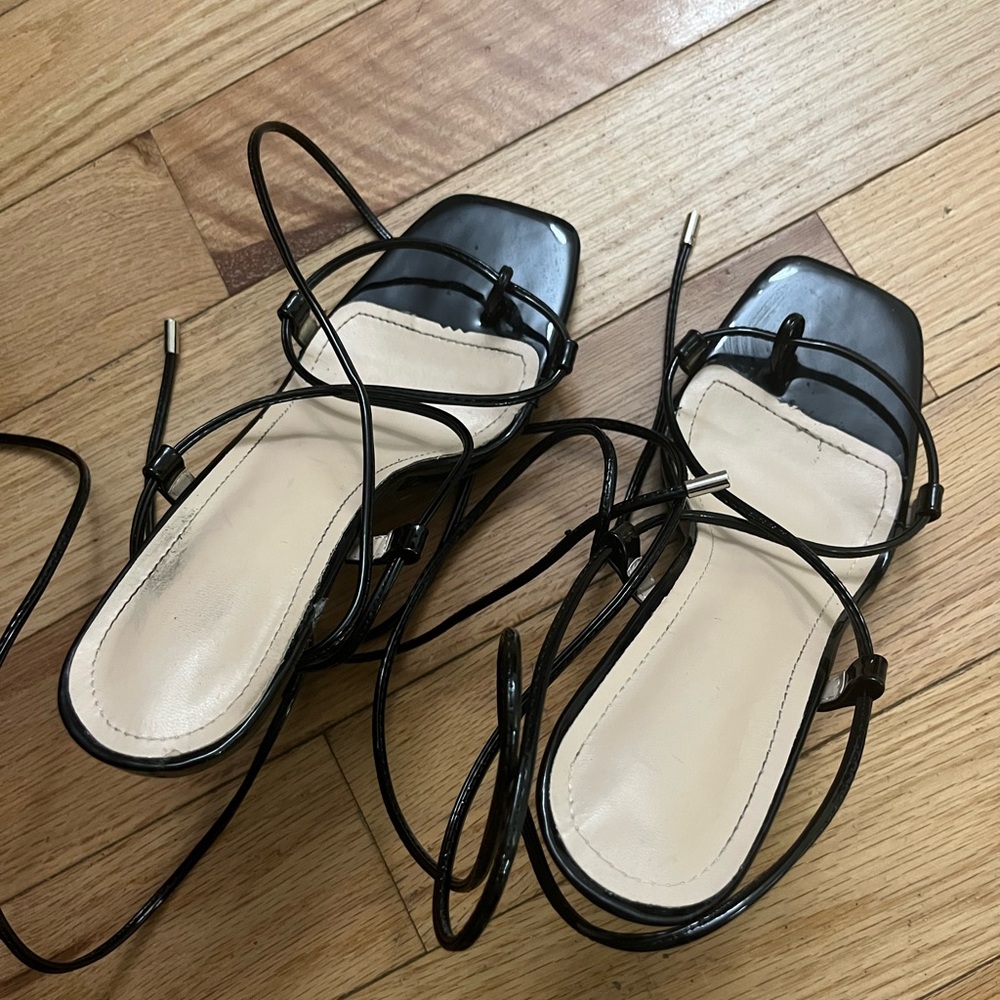 Black tie on strap heels. Just wore once. In great condition.